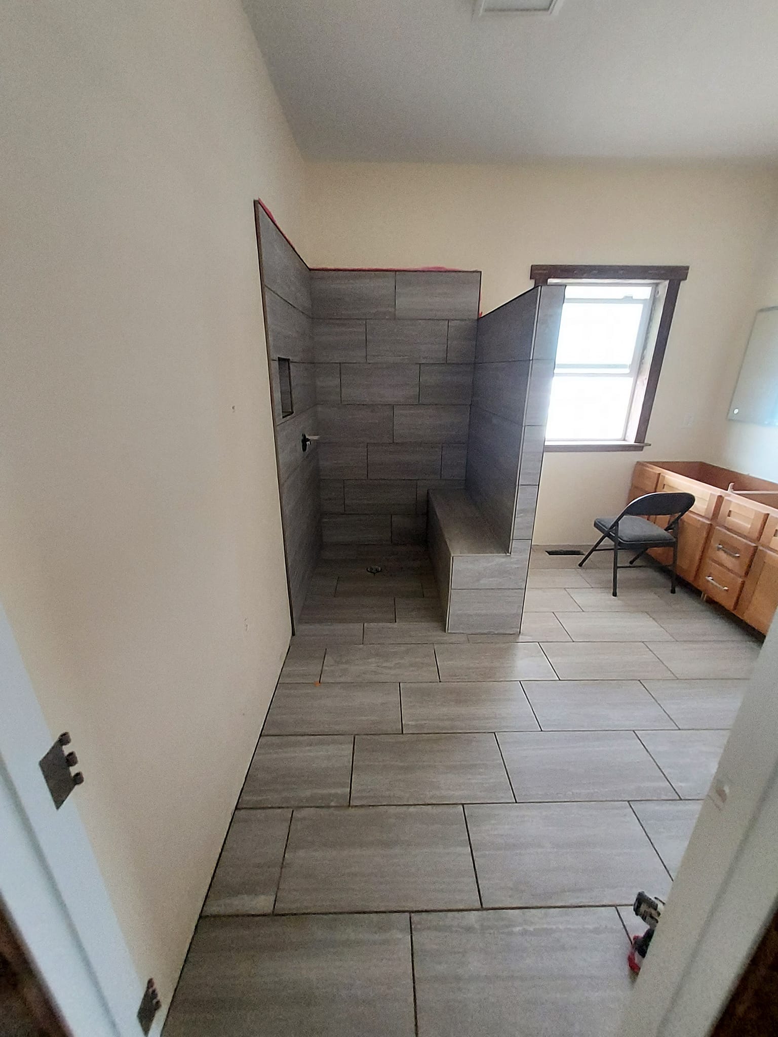 Bathroom with doorless shower
