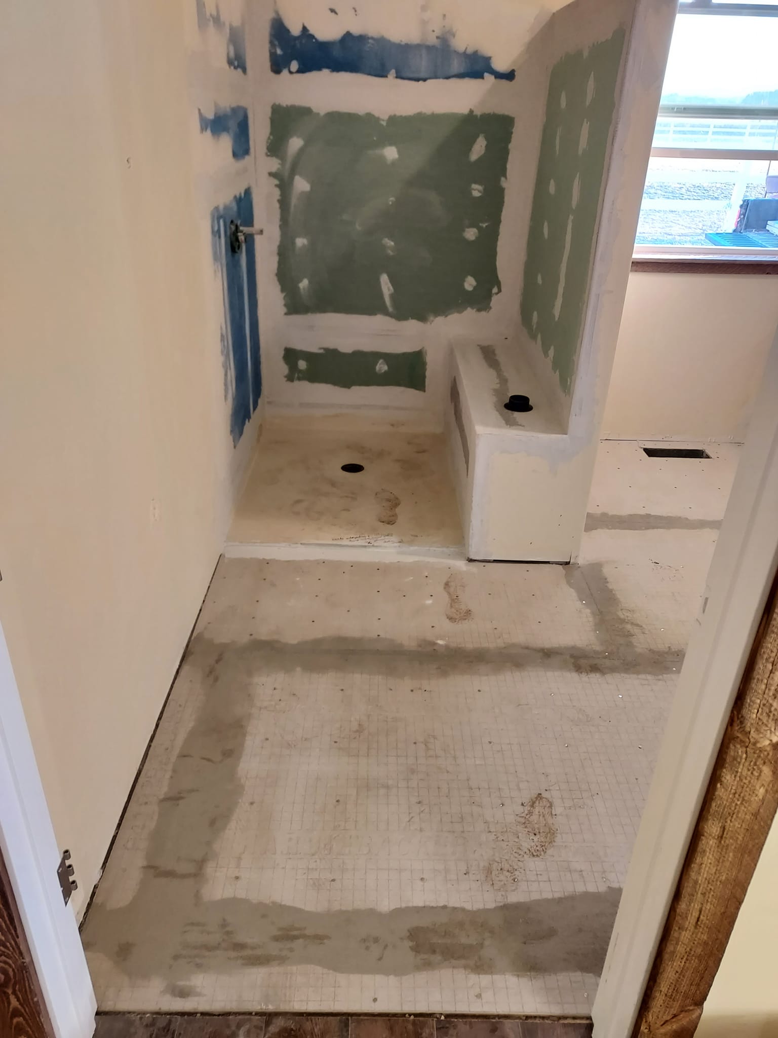 Bathroom with no floor, shower, ready for a remodel