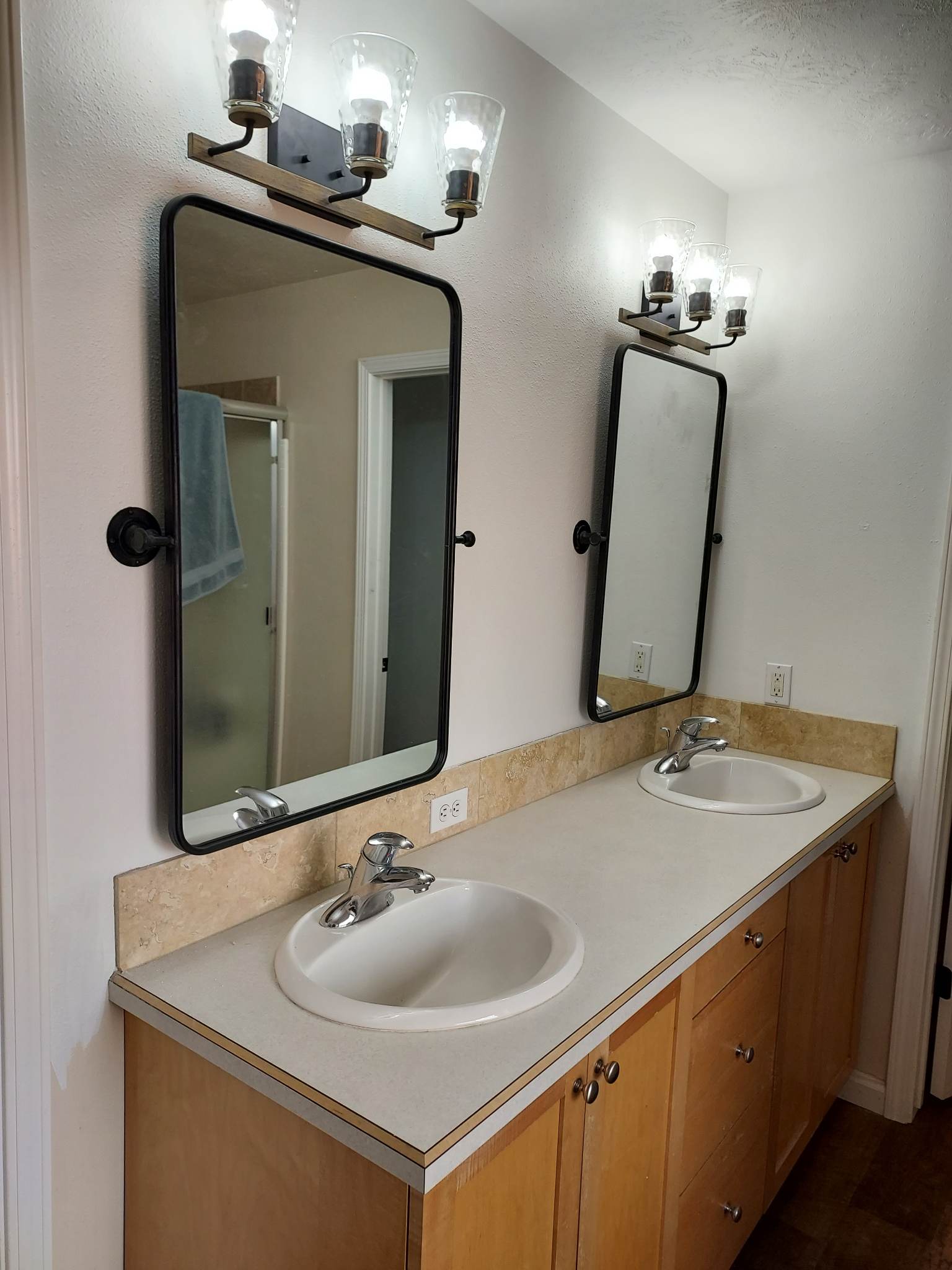 Bathroom cabinet with dual sinks, mirrors and lighting