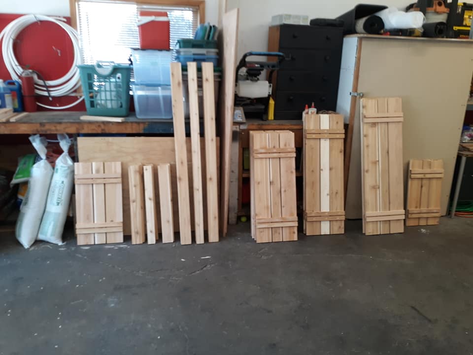 Different size wooden custom shudders ready for install