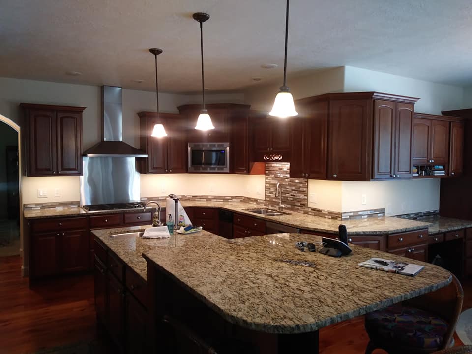 kitchen with dark cabinets and granite counters