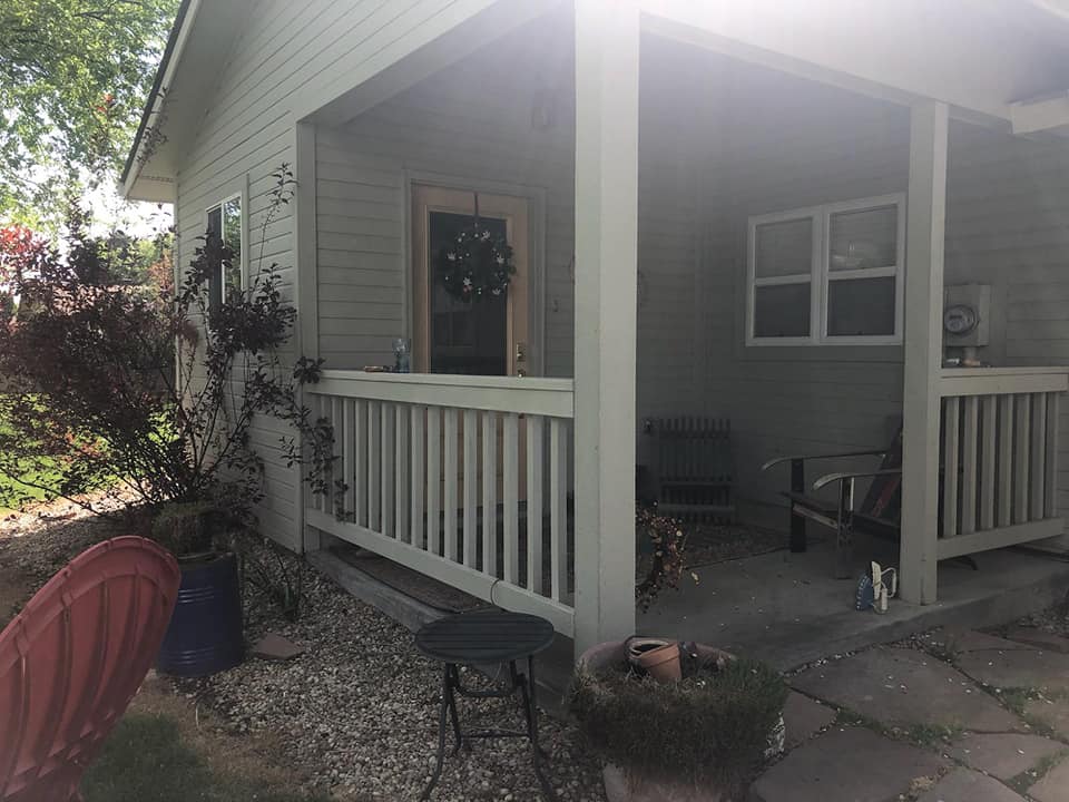 House with old white rails and columns