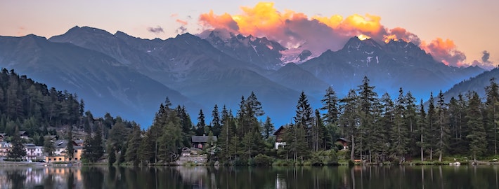 Sunset in the Swiss Alps in front of a beautiful lake