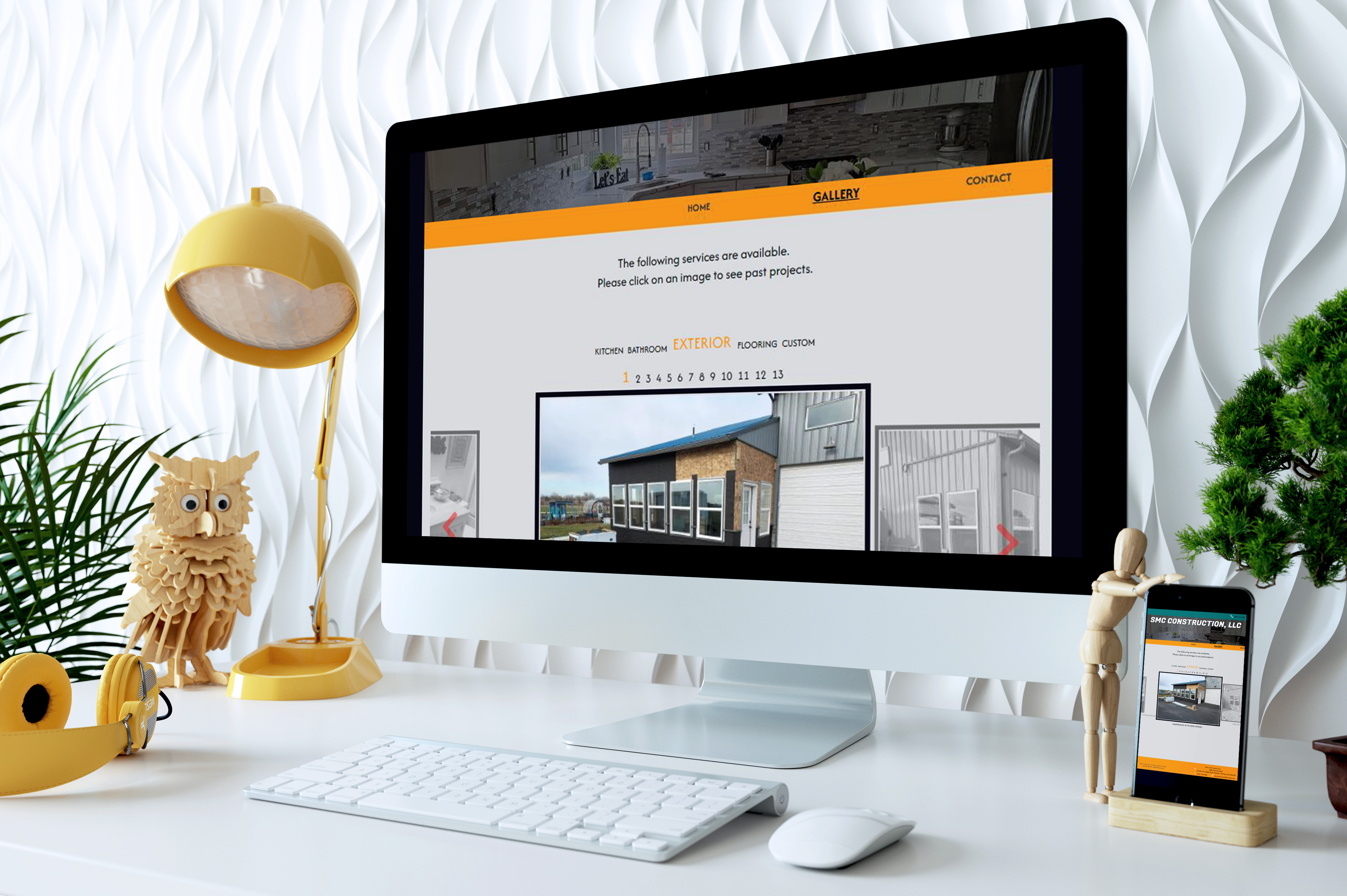 An iMac displaying the SMC Construction website gallery page on a bright, modern desk setup, with a mobile version shown beside it to highlight responsive design