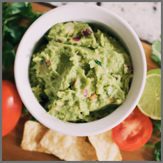 A white bowl of guacamole